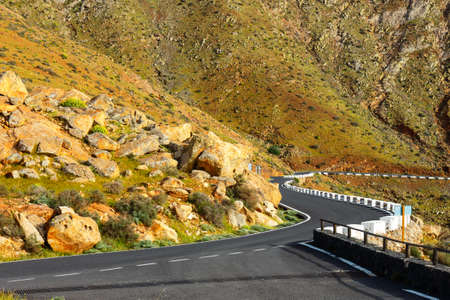 Road in the mountains of Betancuria in the southern part of the Canary island Fuerteventura, Spainの写真素材