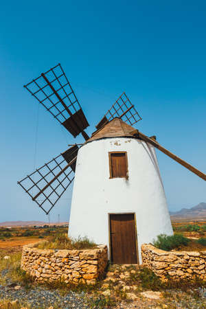 Traditional white stony windmill at Fuertaventura, Canary Islands, Spainの写真素材