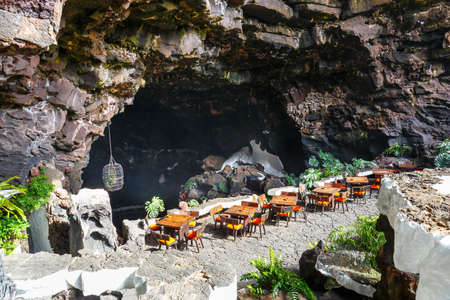 Tables and chairs in volcanic cave in Jameos del Agua, Lanzarote, Canary Islands, Spainの写真素材