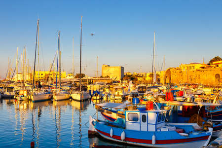 Heraklion, Greece, June 10, 2017: Old harbour of Heraklion with fishing boats and marina during twilight, Crete, Greeceのeditorial素材