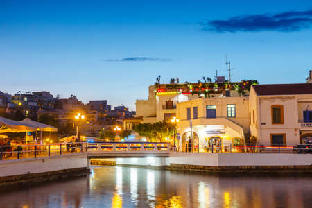 Agios Nikolaos, Crete, Greece - June 08, 2017: Agios Nikolaos town at summer evening. Agios Nikolaos is one of the most touristic cities on Crete island, Greece.のeditorial素材