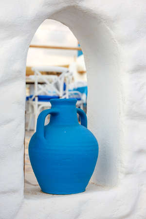 Greek style ceramic blue vase on white wall backgroundの写真素材