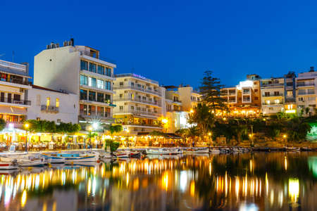 Agios Nikolaos, Crete, Greece - June 08, 2017: Agios Nikolaos town at summer evening. Agios Nikolaos is one of the most touristic cities on Crete island, Greece.のeditorial素材