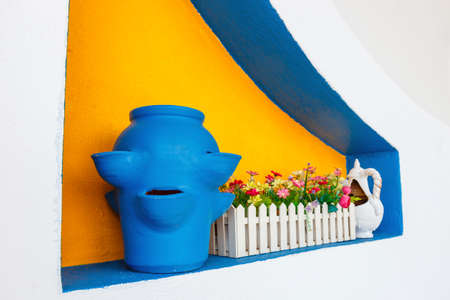 Greek style ceramic blue vase on white wall backgroundの写真素材