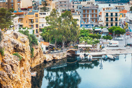 Agios Nikolaos, Crete, Greece - June 07, 2017: Agios Nikolaos town at summer evening. Agios Nikolaos is one of the most touristic cities on Crete island, Greece.のeditorial素材