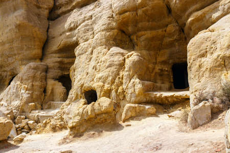 Matala beach. Caves on the rocks were used as a roman cemetery and at the decade of 70's were living hippies from all over the world, Crete, Greeceの写真素材
