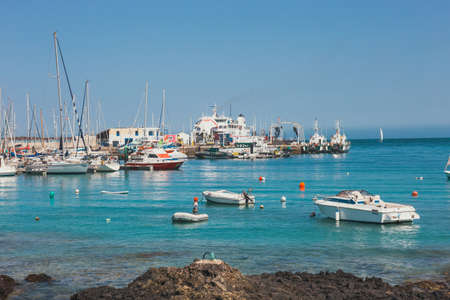 Corralejo, Fuertevetura Island, Spain - April 01, 2017: The skyline of Corralejo with the port and boats in itのeditorial素材