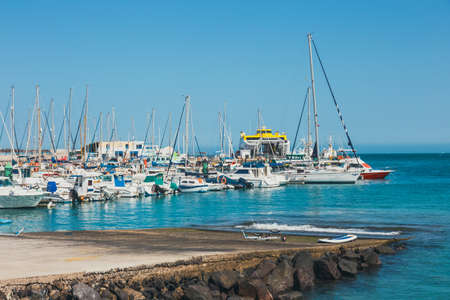 Corralejo, Fuertevetura Island, Spain - April 01, 2017: The skyline of Corralejo with the port and boats in itのeditorial素材