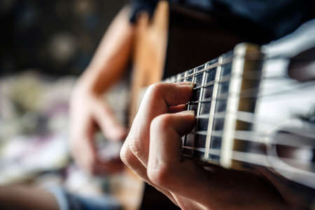 musician playing acoustic guitar, live music backgroundの写真素材