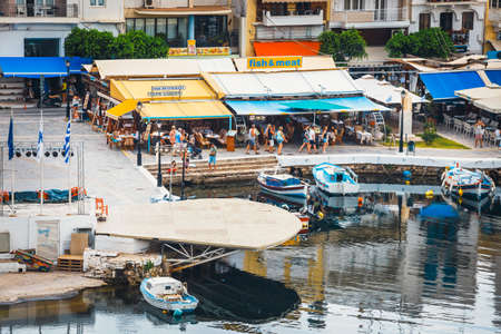 Agios Nikolaos, Crete, Greece - June 07, 2017: Agios Nikolaos town at summer evening. Agios Nikolaos...