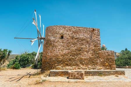 Old stone windmill near the monastery Toplou, Crete island in Greeceの写真素材