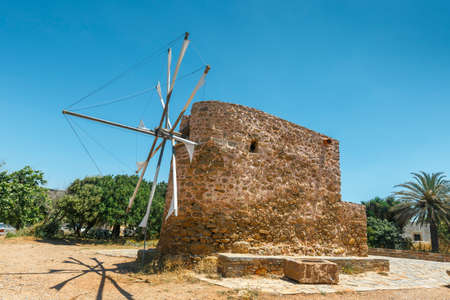 Old stone windmill near the monastery Toplou, Crete island in Greeceの写真素材