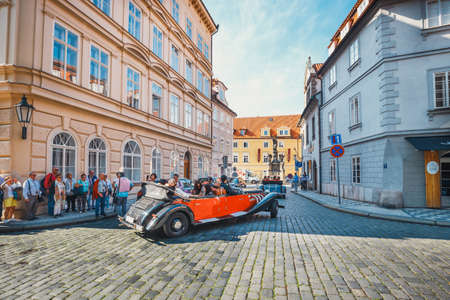 Prague, Czech Republic, September 29, 2017: Red classic retro car for service people and travelers to rent to tour around city at old town in Pragueのeditorial素材