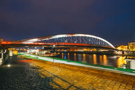 Bernatka footbridge over Vistula river in the night in Krakow, Poland