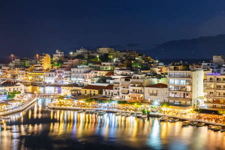 Agios Nikolaos, Crete, Greece - June 08, 2017: Agios Nikolaos town at summer night. Agios Nikolaos is one of the most touristic cities on Crete island, Greeceのeditorial素材