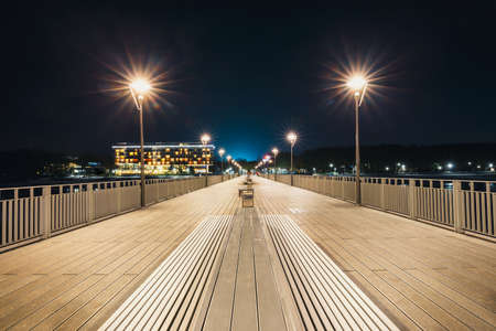 Concrete pier in Kolobrzeg, long exposure shot at night の写真素材