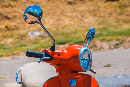 Portugal, Madeira, July 04, 2016: Red scooter Vespa parked in the mountains on Madeira Island, Portugalのeditorial素材