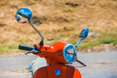 Portugal, Madeira, July 04, 2016: Red scooter Vespa parked in the mountains on Madeira Island, Portugalのeditorial素材