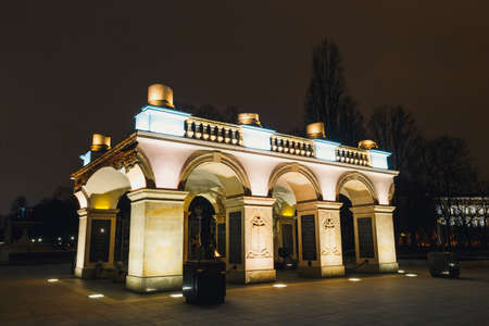 WARSAW, POLAND - March 12, 2016: Night view of the Tomb of the Unknown Soldiers with eternal flame at Pilsudski Square in Warsaw.のeditorial素材