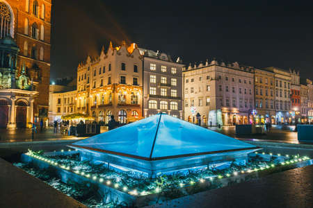 Krakow, Poland, January 22, 2017: Fountain at night on main square of Krakow city, Polandのeditorial素材