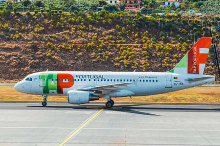 Funchal, Madeira - July 6, 2016: TAP Portugal Airbus A319-111 at Funchal Cristiano Ronaldo Airport, boarding passengers.This airport is one of the most dangerous airports in Europeのeditorial素材