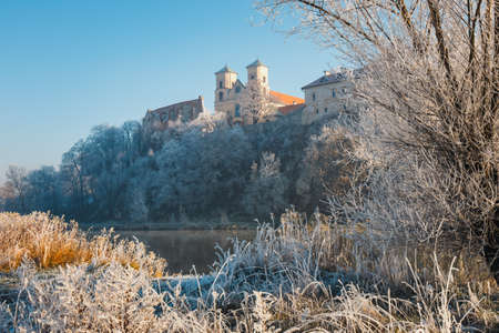 Hoarfrost on the grass and the benedictine abbey in Tyniec in the background, Polandの写真素材