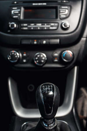 close up of gear shift in the car and central console in the backgroundの写真素材