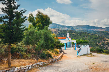 White chapel and mountains in the backgroud, Crete Island, Greeceの写真素材