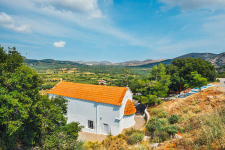 White chapel and mountains in the backgroud, Crete Island, Greeceの写真素材