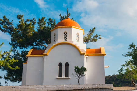 White chapel with red roof in the mountains, Crete Island, Greeceの写真素材