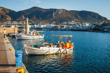 Hersonissos, Crete, June 13, 2017: Ships and fishing boats in the harobor at sunset