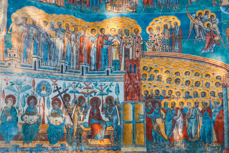 Voronet, Romania, July 06, 2015: Orthodox church exterior with painted murals, painted church in Romaniaのeditorial素材