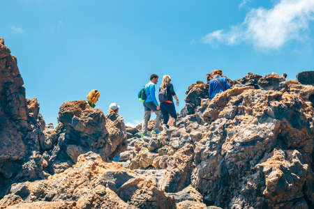 Tenerife, Spain, June 07, 2015: unknown people are walking along the mountain path at the top of the el teide volcano, Spainのeditorial素材