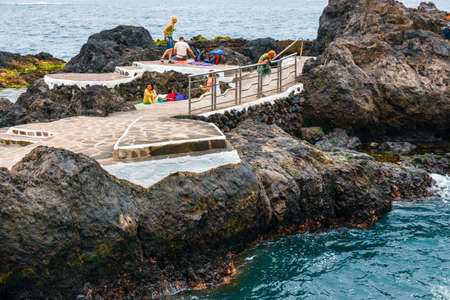 Garachico, Tenerife Island, Spain, 08 JUNE 2015: Natural volcanic pools visited by tourists in Garachico, Tenerife Island, Canary, Spainのeditorial素材