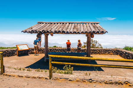 Tenerife, Spain, June 04, 2015: Unknown people visit viewpoint above the clouds in Teide National Park in Tenerife, Spainのeditorial素材
