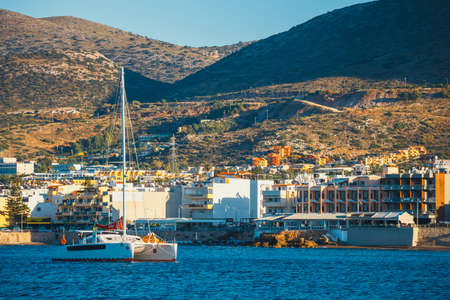 Hersonissos, Crete, June 13, 2017: Ships and fishing boats in the harbor at sunsetのeditorial素材