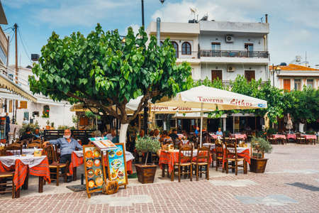 Mochos, Crete - June 13, 2017: Tavern Lithos on the main square in the village of Mochos on Crete Island, Greeceのeditorial素材