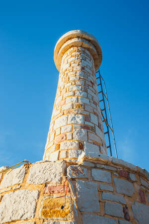 Lighthouse in old harbor in Rethymno, Crete, Greeceの写真素材