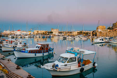 Heraklion, Greece, June 10, 2017: Old harbour of Heraklion with fishing boats and marina during twilight, Crete, Greeceのeditorial素材
