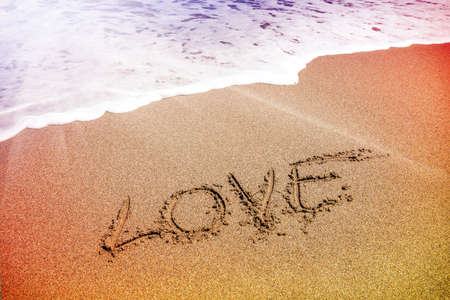  love inscription on the sand near the seaの写真素材