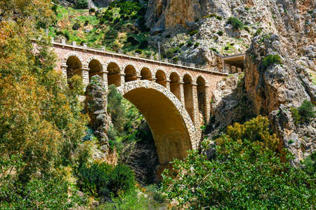 stone railway bridge in the village of el chorro at the end of trail of Caminito Del Reyの写真素材