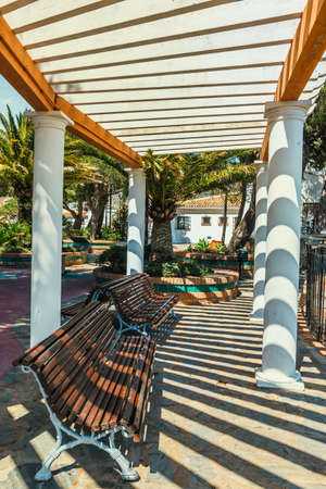 Sun shining over the arcade arch building, Mijas, Spainの写真素材