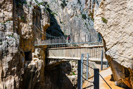 Caminito Del Rey, Spain, April 04, 2018:  Visitors crossing the suspension bridge at Gaitanes Gorge, Malaga, Spainのeditorial素材