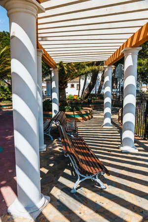Sun shining over the arcade arch building, Mijas, Spainの写真素材