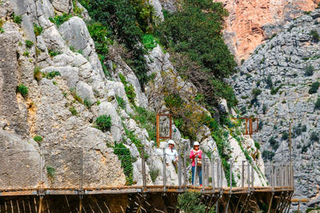 Caminito Del Rey, Spain, April 04, 2018: Visitors walking along the  World's Most Dangerous Footpath reopened in May 2015. Ardales, Spain.のeditorial素材