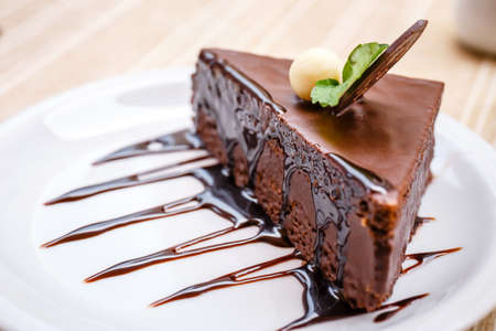 Delicious gingerbread cake with chocolate on white plateの写真素材