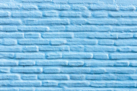 Horizontal blue brick wall background, facade of the house