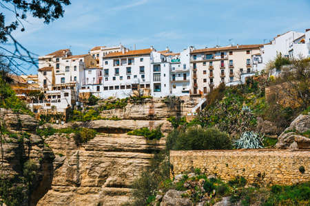 El Tajo Gorge Canyon with white spanish houses in Ronda, Spainの写真素材
