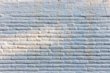 Horizontal brick wall background, white facade of the houseの写真素材