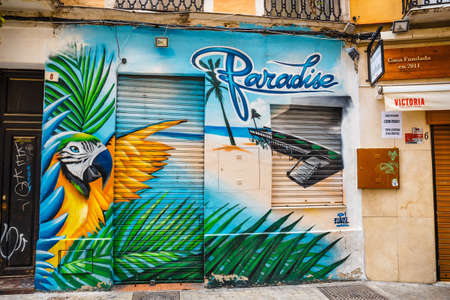 Malaga, Spain, April 03, 2018: Narrow street in the historical center of Malaga where tourists are seeking for shopsのeditorial素材